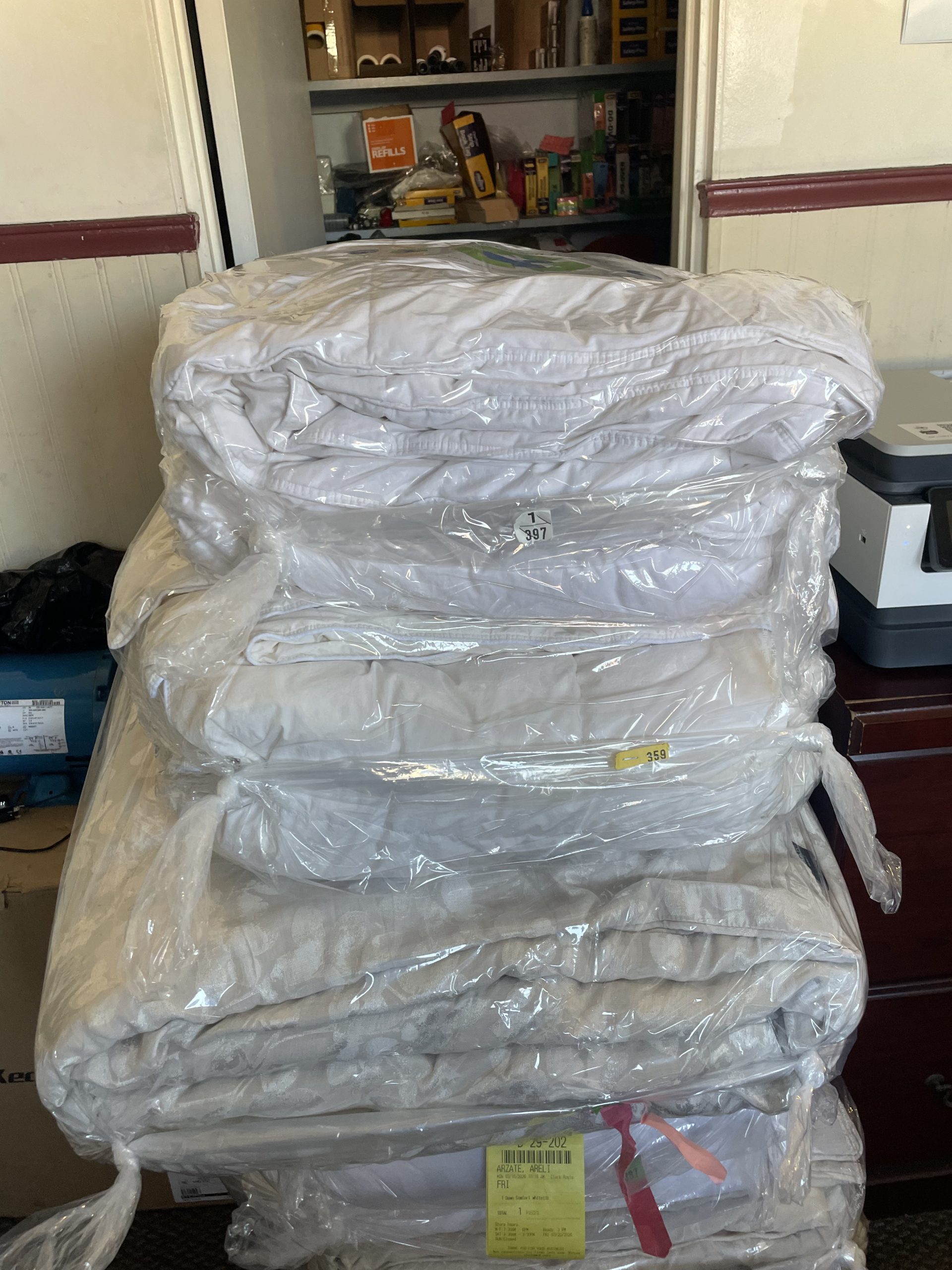 Clean comforters tightly packed in wrap